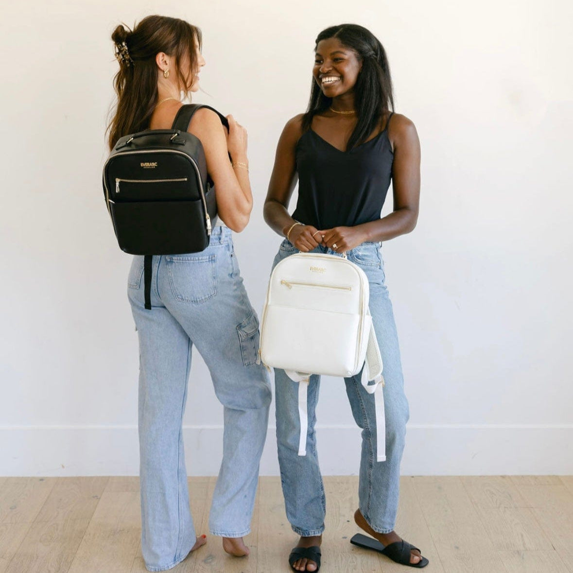 Women with black and white backpacks