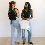 Women with black and white backpacks