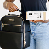 Woman holding Everarc backpack and device