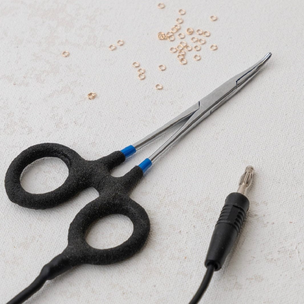 Black scissors and jack with small rings, FullSizeRender