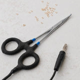 Black scissors and jack with small rings, FullSizeRender