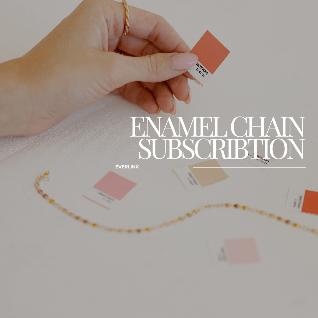 Hand holding color swatch with a necklace.
