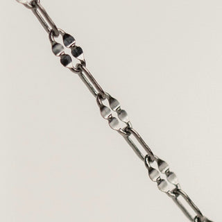 Silver clover chain necklace detail