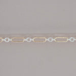 Gold and silver chain on a gray background