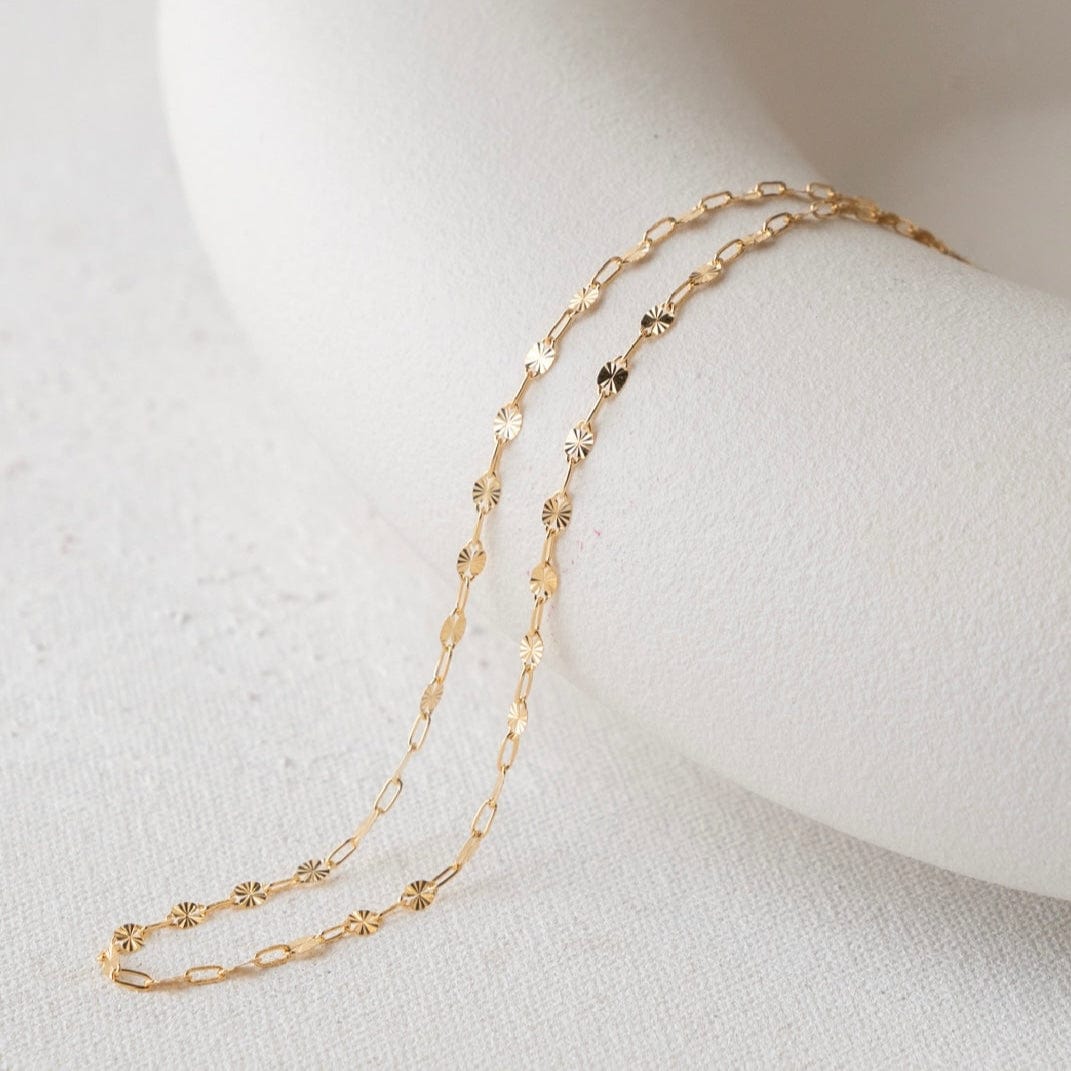 Gold necklace on white display - 34D49BE5
