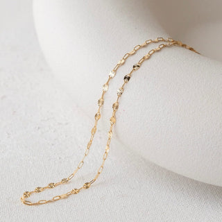 Gold necklace on white display - 34D49BE5