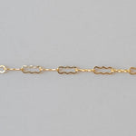 Gold chain on a gray background