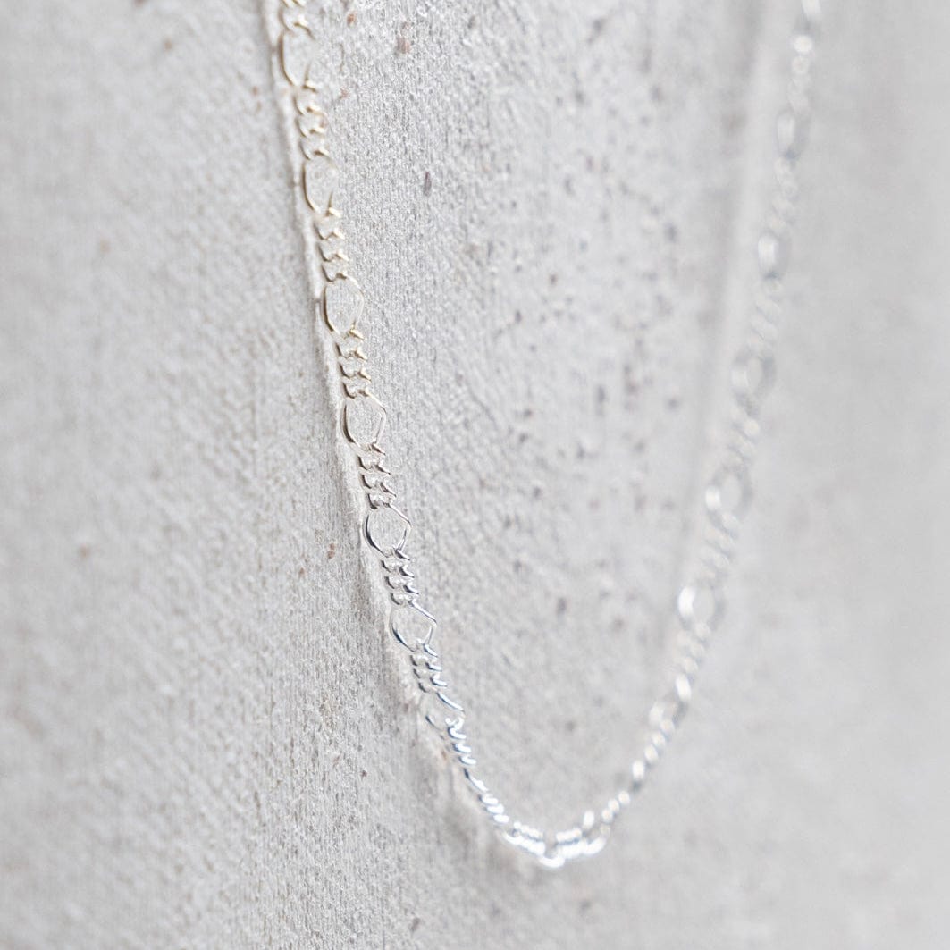 Silver chain necklace on white background