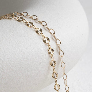 Gold chain necklace on white display - 55560D2E