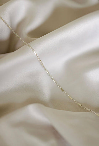 Silver chain necklace on satin (7D0781FC)
