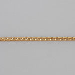 Gold chain on a gray background