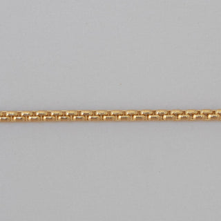 Gold chain on a gray background
