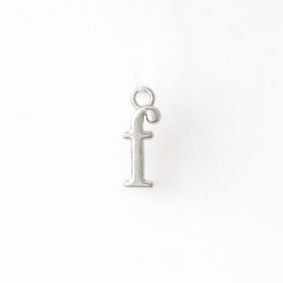 Silver 'f' pendant on a white background
