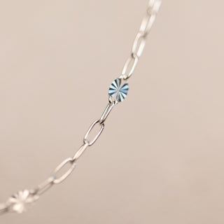 Silver chain necklace with blue crystal detail