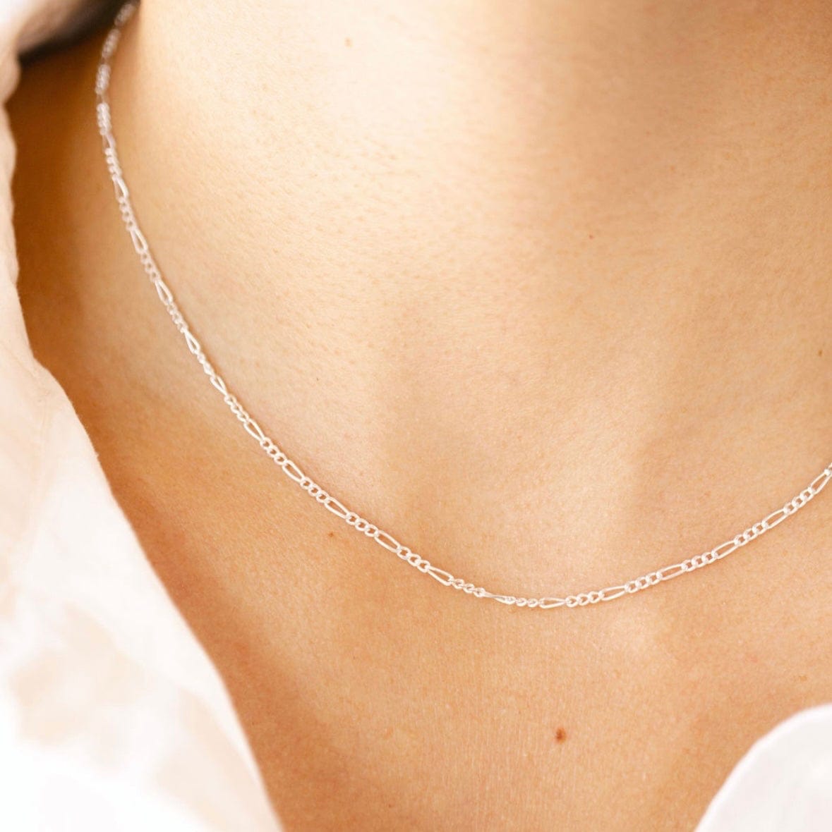 Silver necklace on neckline