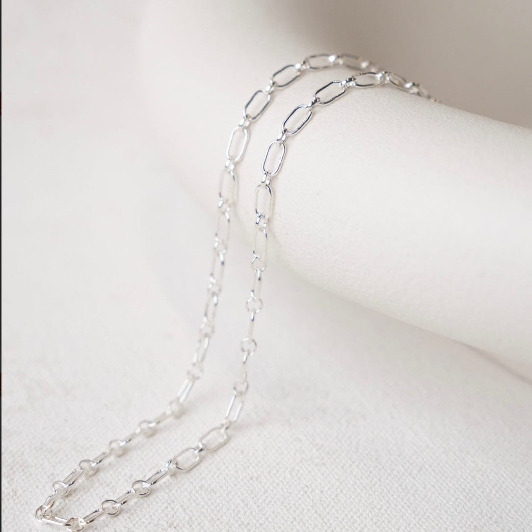 Silver chain necklace on white background