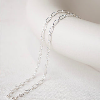 Silver chain necklace on white background