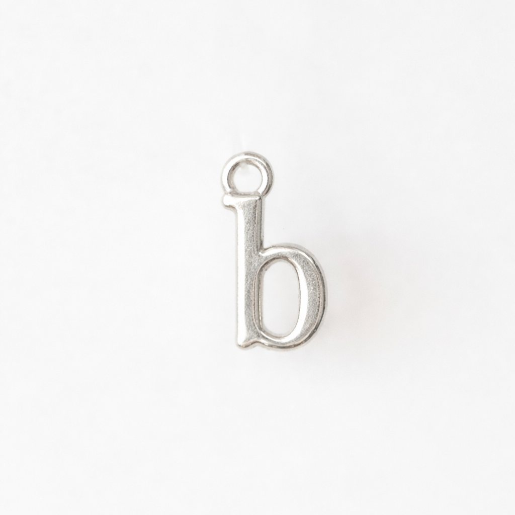 Silver letter 'b' charm on a white background