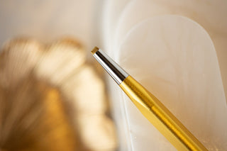 Close-up of gold chisel tool CA4A9D8E-A10B-48CA-A25A-B1ED8B1C8B2C