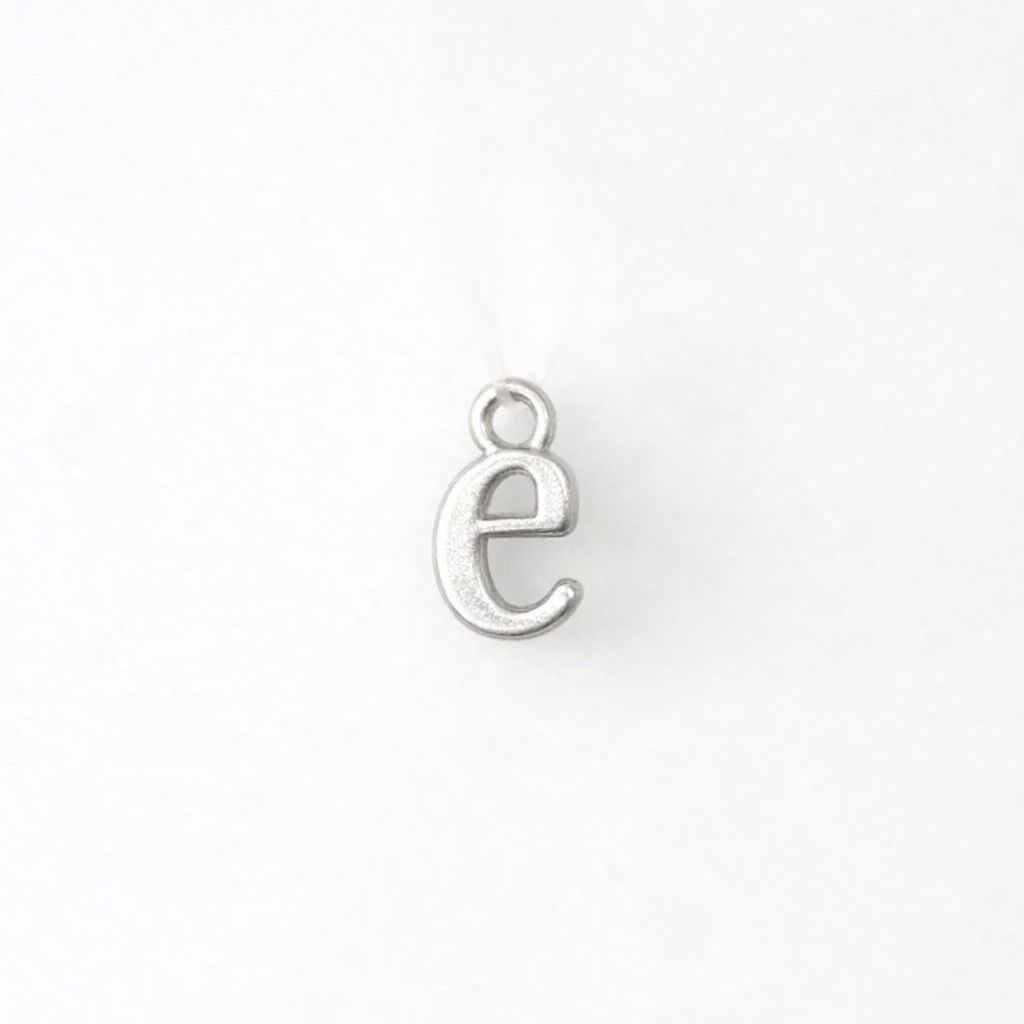 Silver letter 'e' charm on a white background
