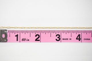 Chain14 gold chain measured with a pink ruler.