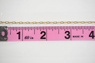 Chain17 gold chain measured with a ruler