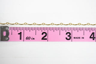 Chain27 gold chain next to a ruler for measurement.