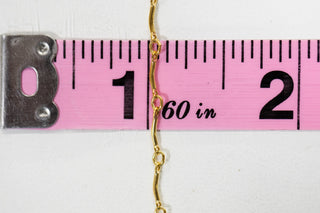 Chain27 gold necklace length measured with tape measure