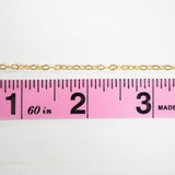 Gold chain necklace Chain38 next to ruler