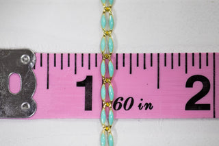 Mint chain necklace with gold accents, measured at 1.60 inches