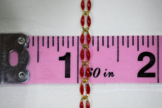 Red and gold chain, 1 inch, measured with pink ruler