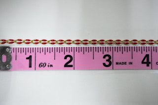 Red and gold chain with a ruler for scale