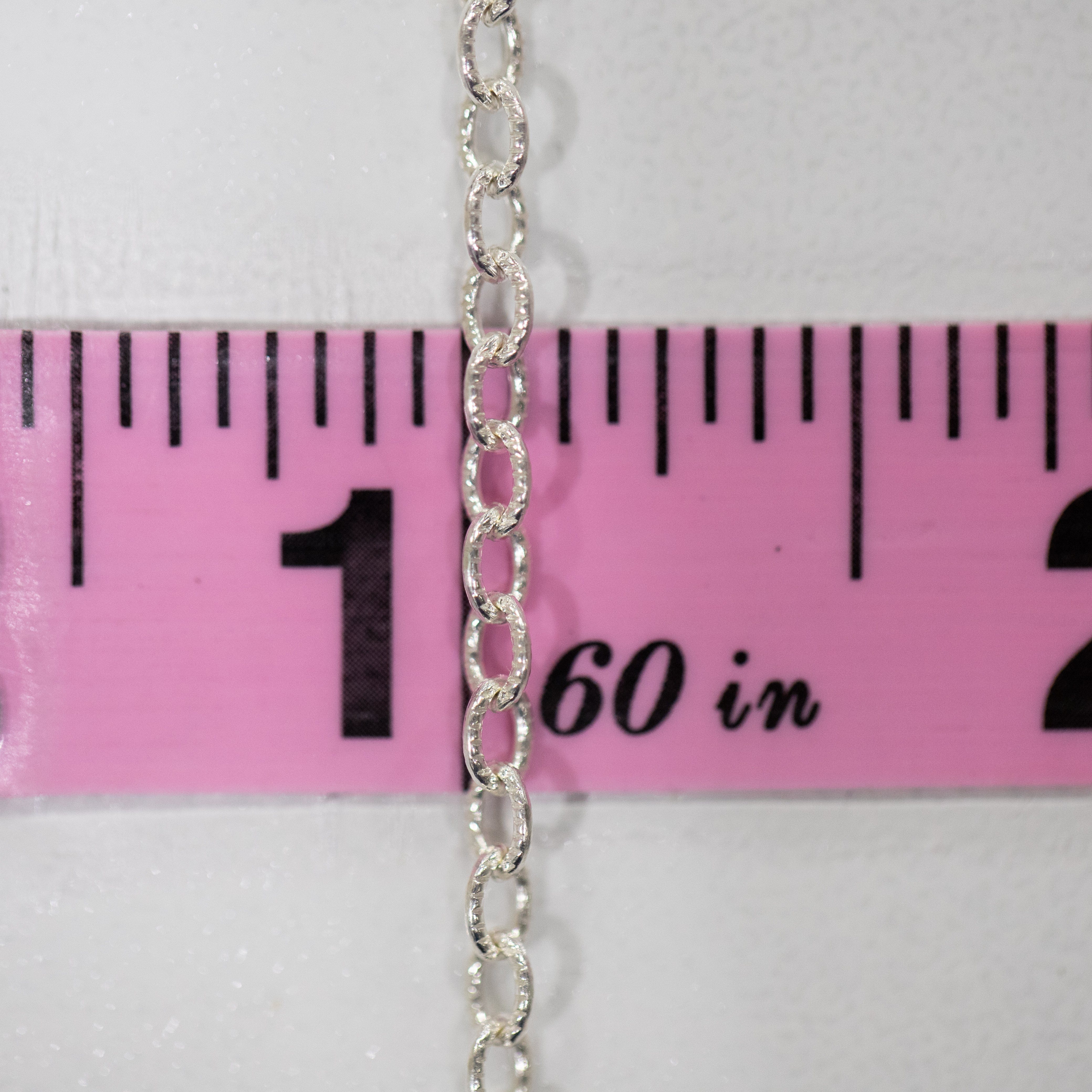 Silver chain measured with ruler