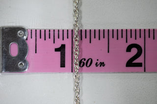 Silver chain 1 inch, measured on pink ruler