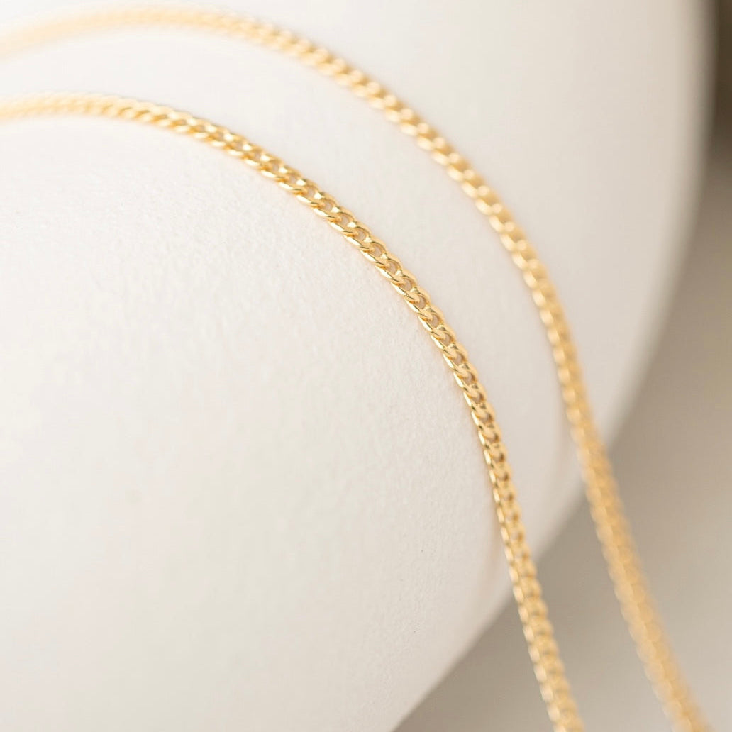 Gold chain necklace detail