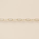 Gold chain on a beige background