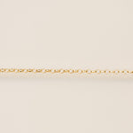 Gold chain on a beige background