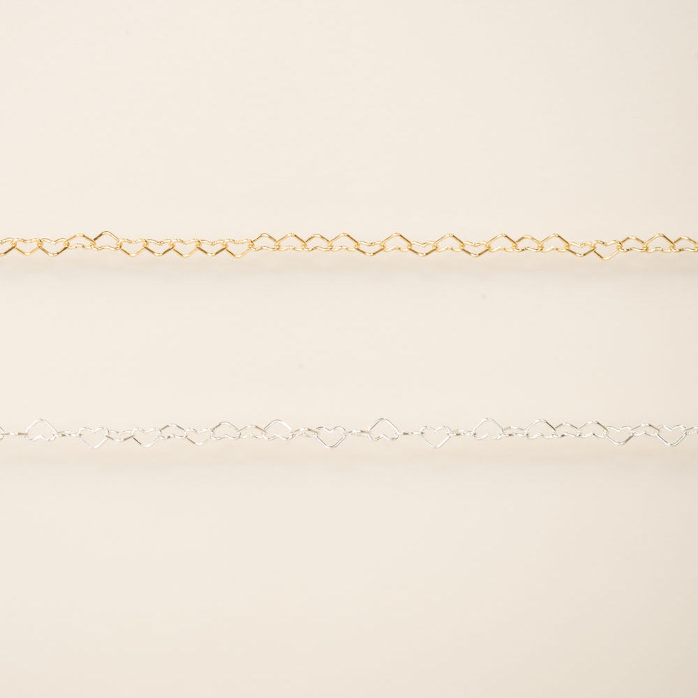 Gold chain on a beige background