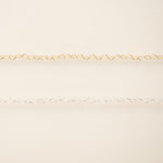 Gold chain on a beige background