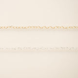 Gold chain on a beige background