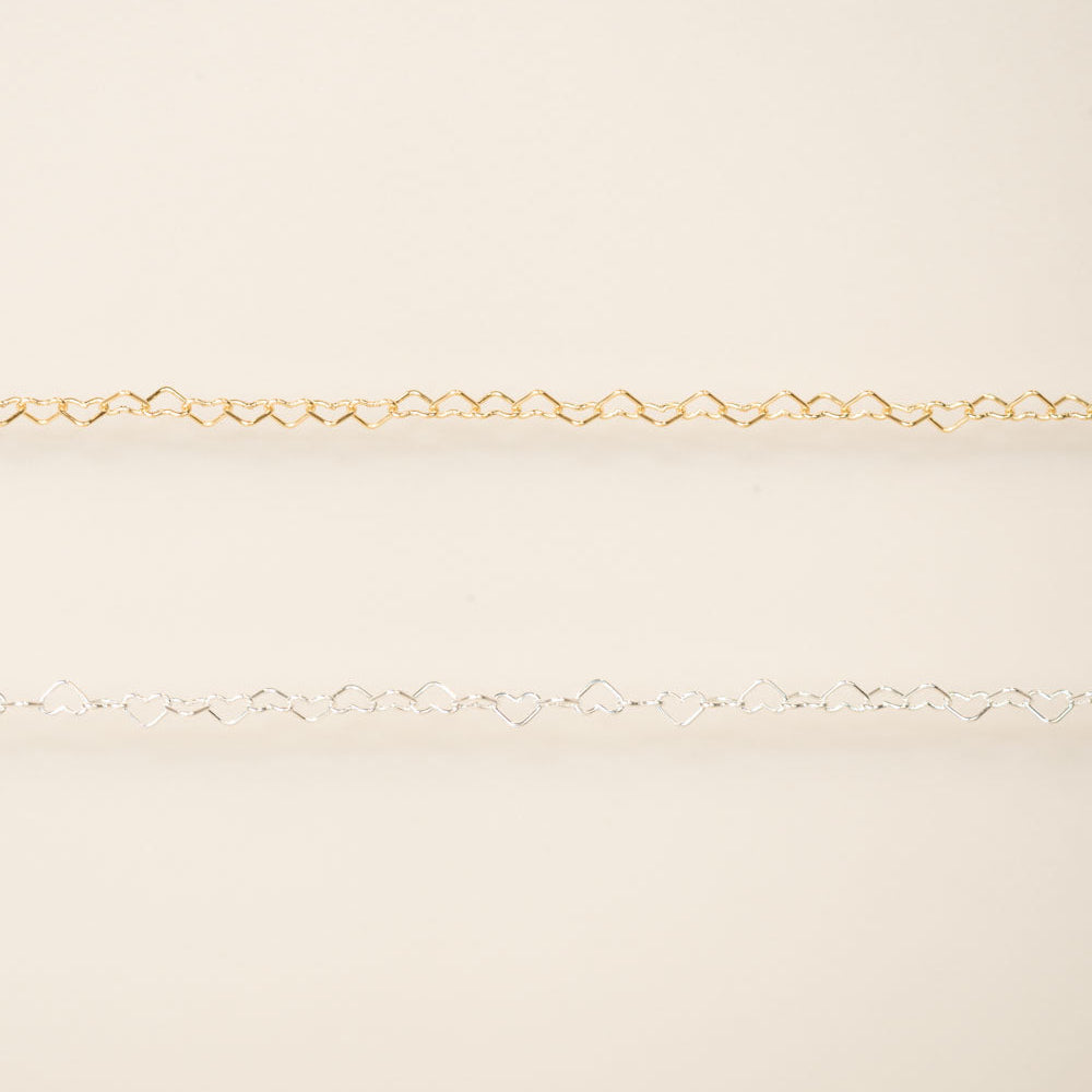 Gold chain on a beige background