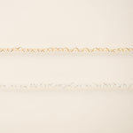 Gold chain on a beige background
