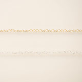 Gold chain on a beige background