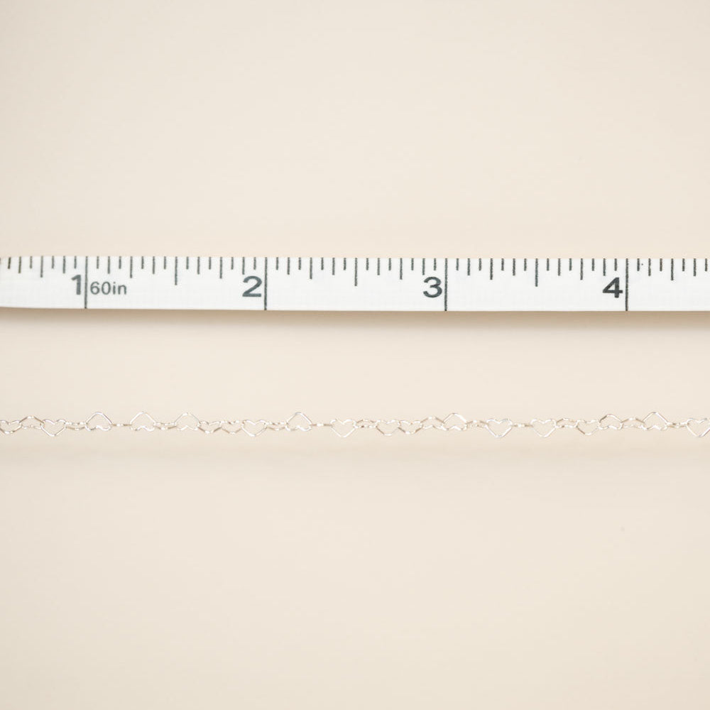 Beige fabric with a ruler at the top for scale