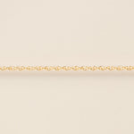 Gold chain on a beige background