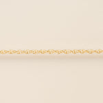 Gold chain on a beige background