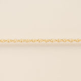 Gold chain on a beige background