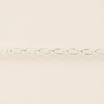 Silver chain on a beige background