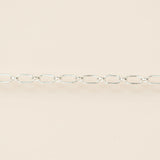 Silver chain on a beige background