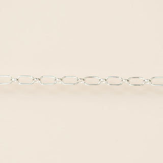 Silver chain on a beige background